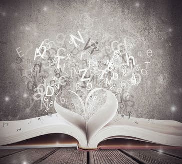 A Lesson in Vocabulary article. This picture shows a heart inside of a book with letters floating around.