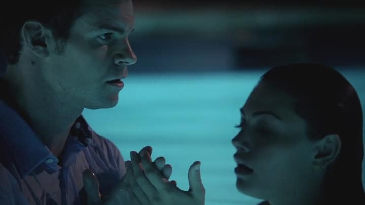 Elijah checks Hayley's hand to see if the spell has been lifted. Photo: CW
