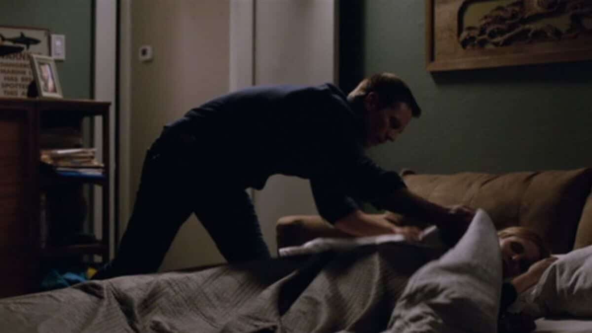 Logan puts a blanket over Veronica lying in bed.