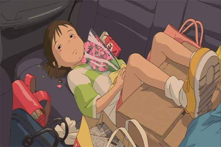 In the beginning of Spirited Away,Chihiro being whisked by her parents to her new home.