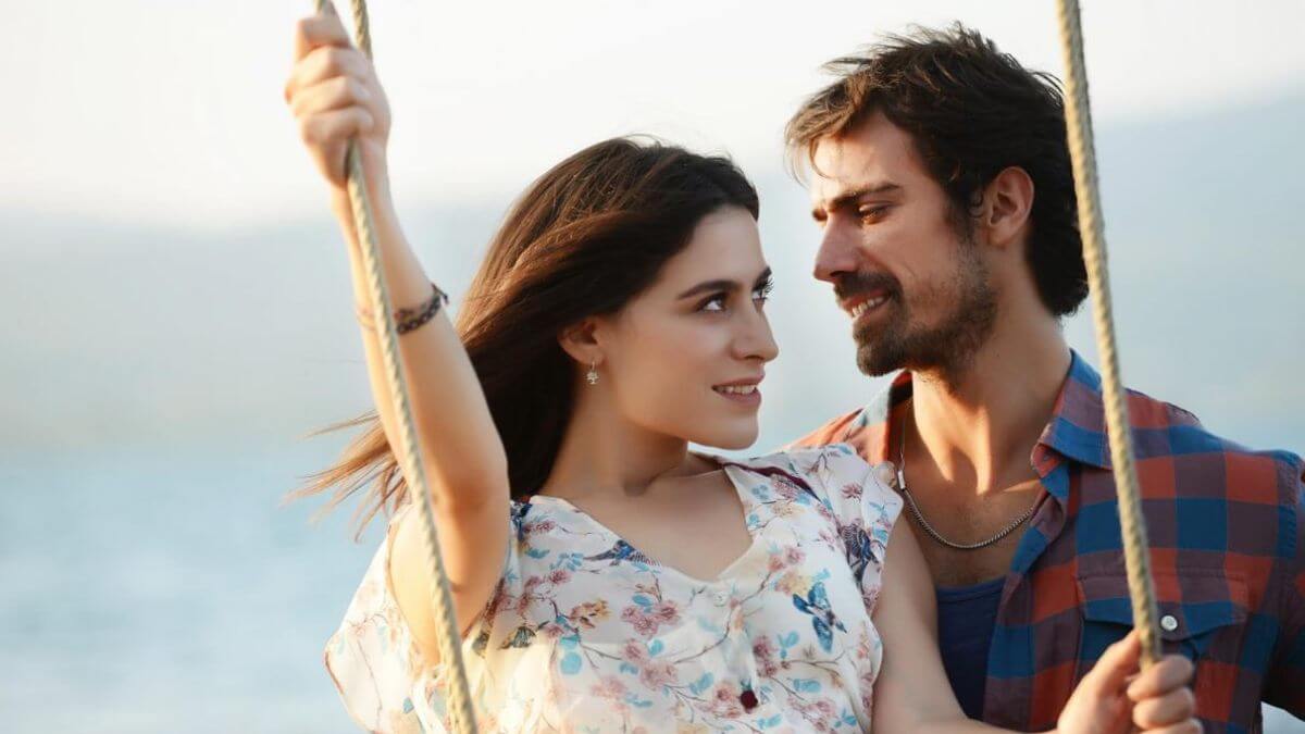 sadece sen publicity still of a couple on a swing smiling at each other