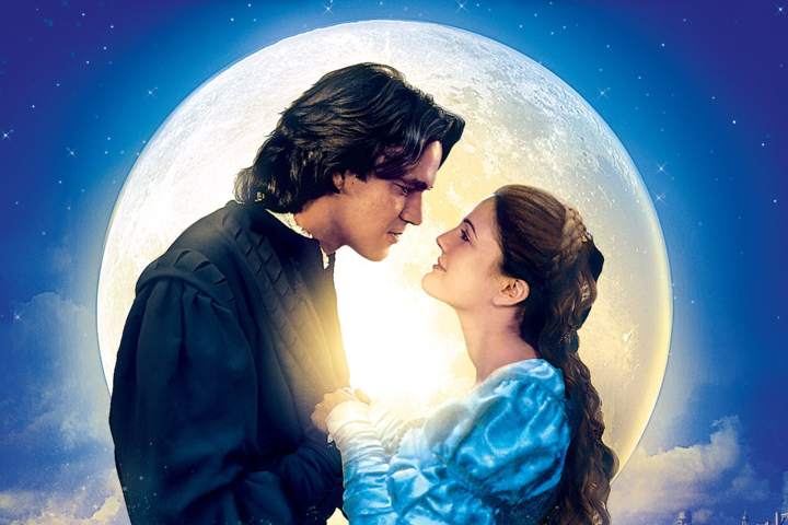 Ever After promo photo with a moon behind the couple smiling at each other.