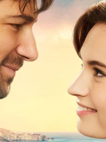 The Guernsey Literary and Potato Peel Pie Society review featured image showing a couple smiling at each other.