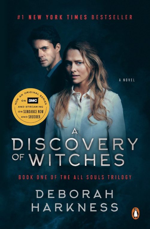 a discovery of witches tie in book cover showing the actors playing Matthew and Diana in the adaptation