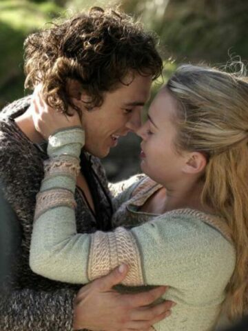 Tristan and Isolde publicity photo with James Franco and Sophia Myles. They're smiling and leaning in to kiss.