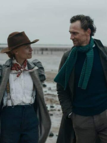 The Essex Serpent Review featured image with Claire Danes and Tom Hiddleston walking on the beach in Victorian costumes