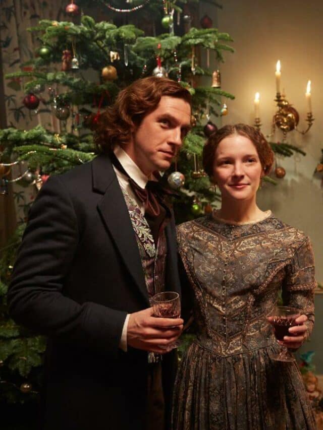 cropped-the-man-who-invented-christmas-publicity-still-with-christmas-tree-and-couple-1.jpg