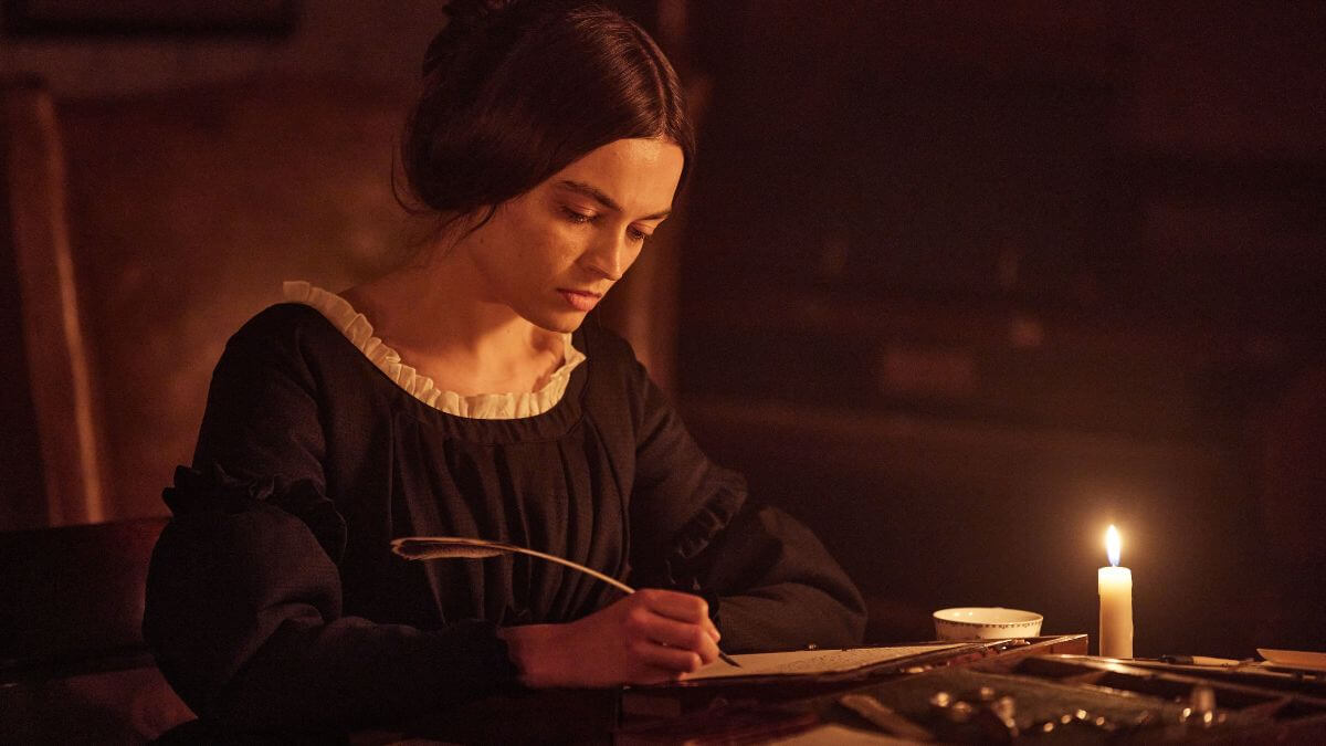 Emily movie still. Picture shows Emily Bronte writing.