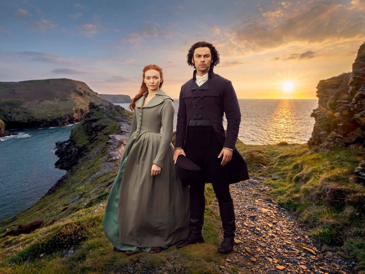 Demelza and Ross promo photo from Poldark with sunset