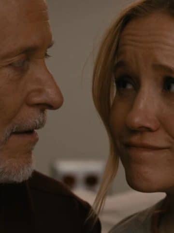 Hannah and Dean romantic moment. They look at each other warmly.