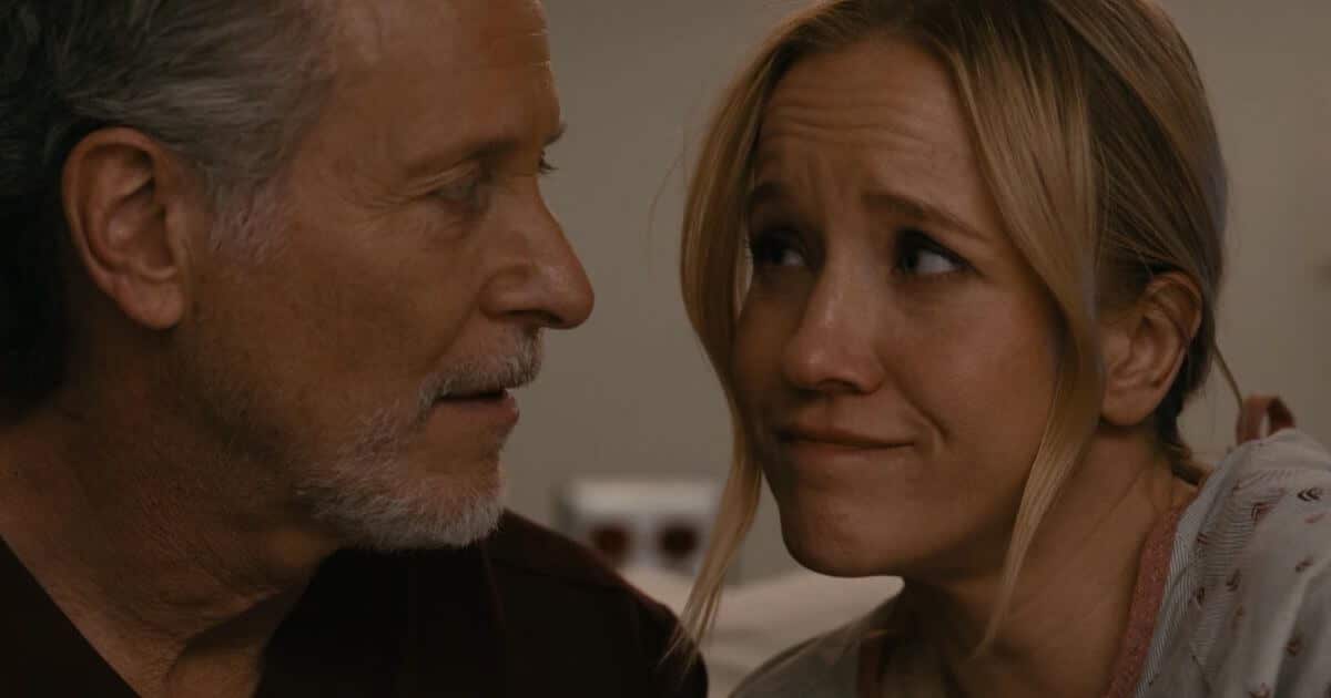 Hannah and Dean romantic moment. They look at each other warmly.